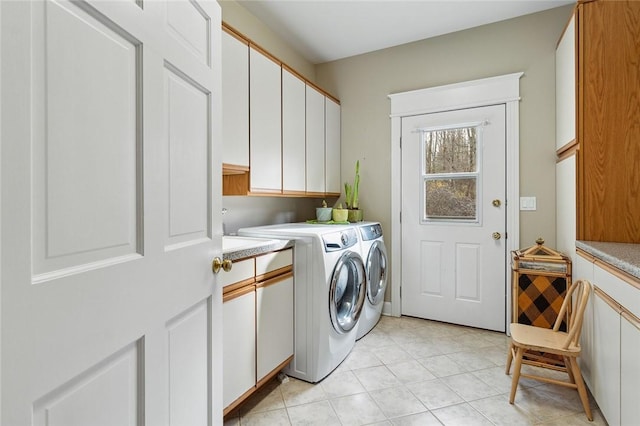 washroom with cabinets and independent washer and dryer