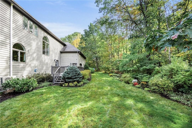 view of yard featuring a wooden deck