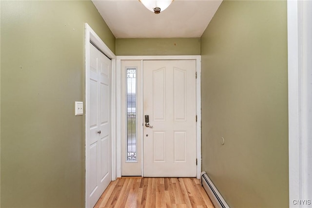 doorway featuring light hardwood / wood-style floors and baseboard heating