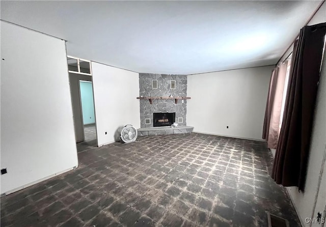 unfurnished living room featuring a fireplace