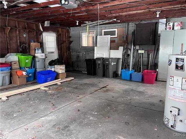 garage featuring water heater and a garage door opener