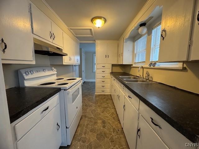 kitchen with electric range, white cabinets, and sink