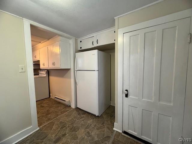 kitchen featuring white refrigerator, washer / clothes dryer, white cabinetry, and baseboard heating