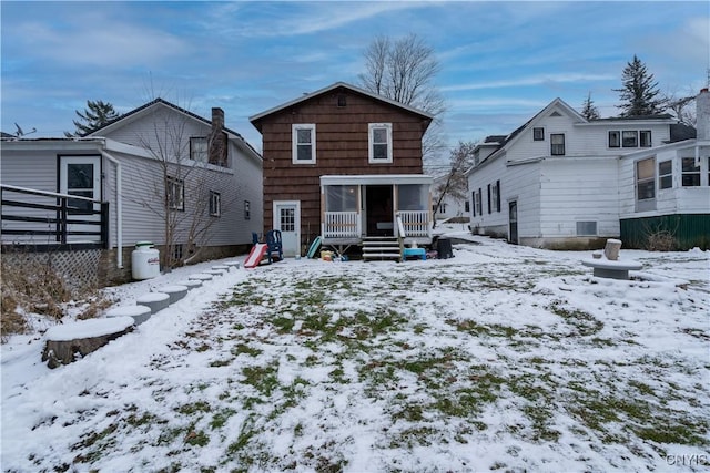 view of snow covered house