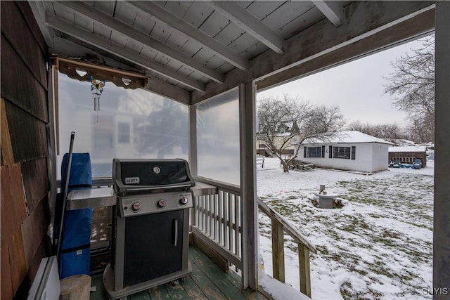 snow covered deck with area for grilling