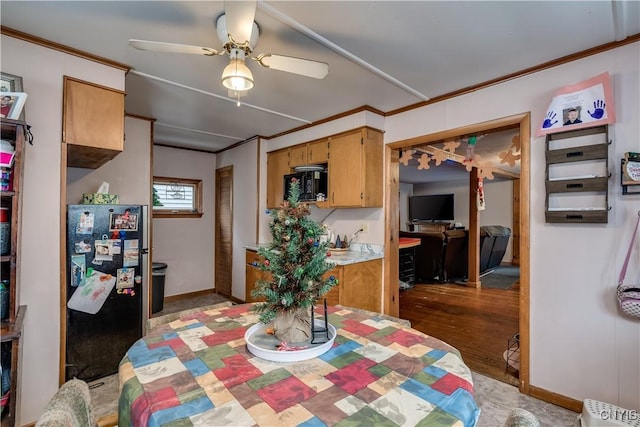 dining space with crown molding, hardwood / wood-style floors, and ceiling fan