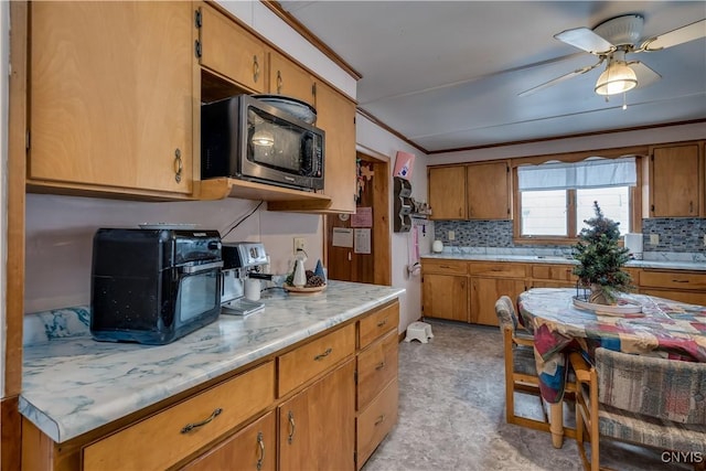 kitchen with ceiling fan and ornamental molding