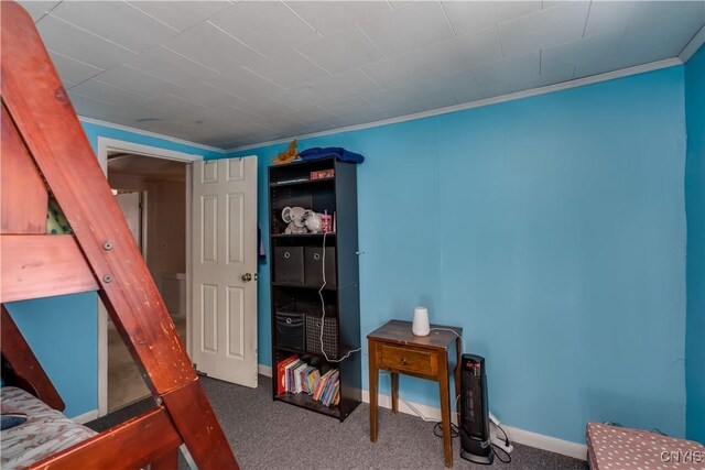 carpeted bedroom with ornamental molding