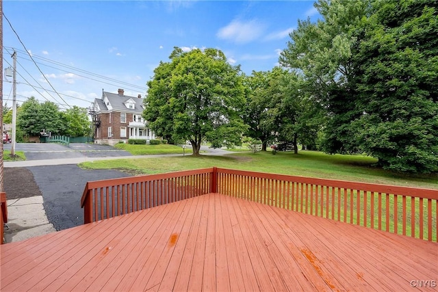 wooden deck with a yard