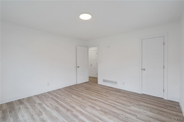 spare room with light hardwood / wood-style floors