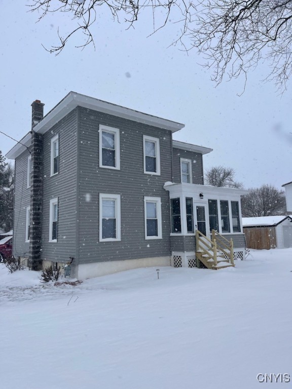 view of snow covered house