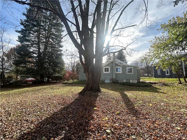 view of home's exterior with a lawn