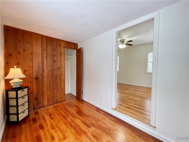 spare room featuring hardwood / wood-style floors and ceiling fan