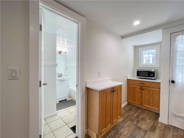 interior space with sink and light hardwood / wood-style flooring