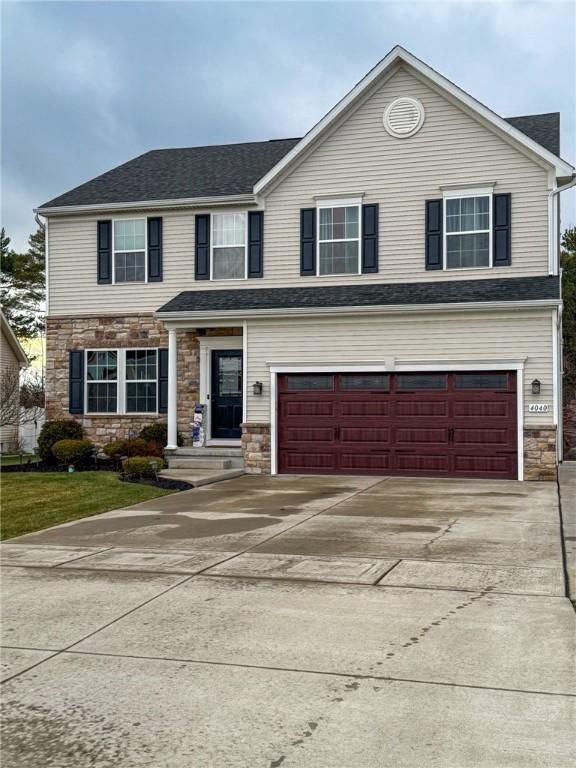 view of front of property with a garage