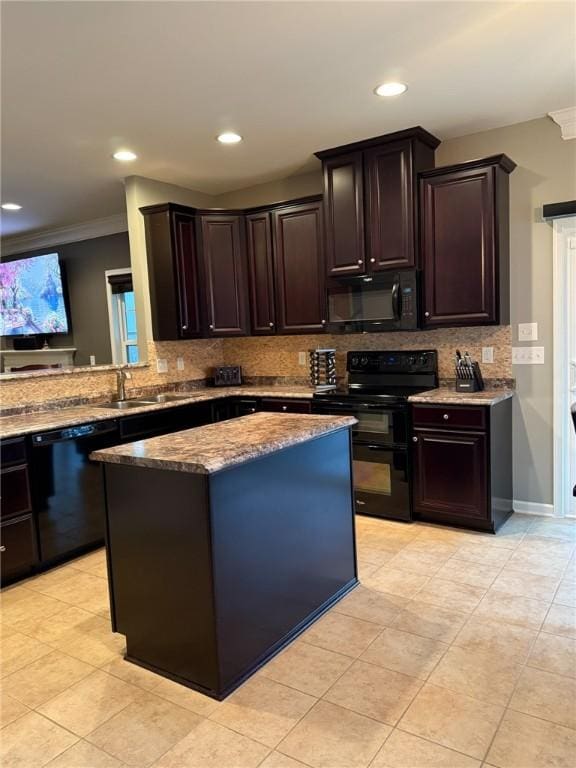 kitchen with black appliances, dark brown cabinets, crown molding, and sink