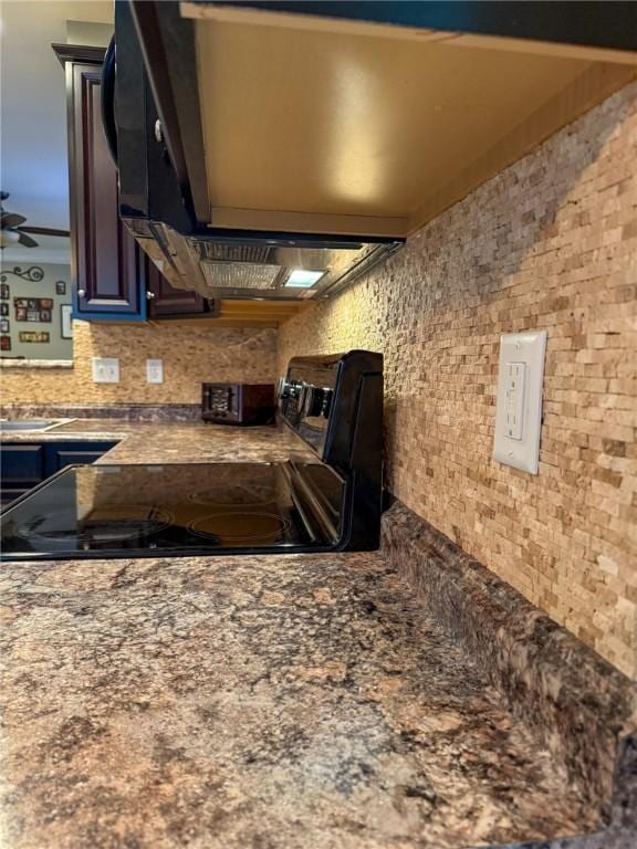 kitchen with decorative backsplash, ceiling fan, and range