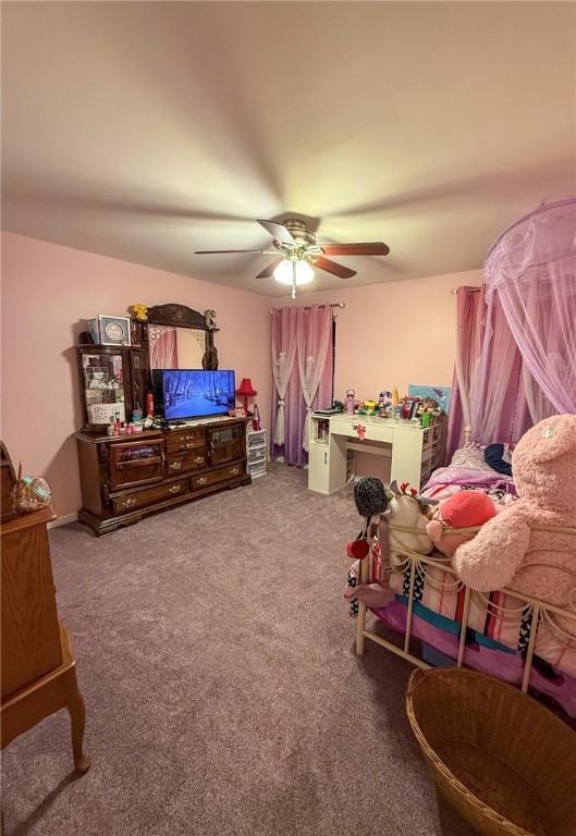 carpeted bedroom with ceiling fan