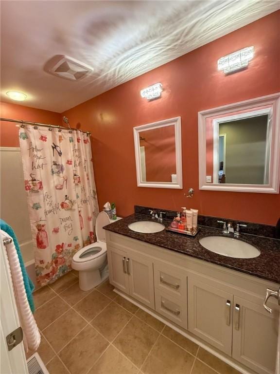 full bathroom with toilet, shower / tub combo with curtain, vanity, and tile patterned flooring