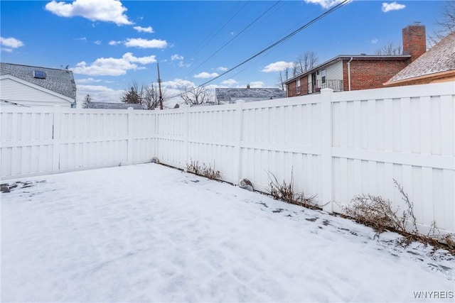 view of yard covered in snow