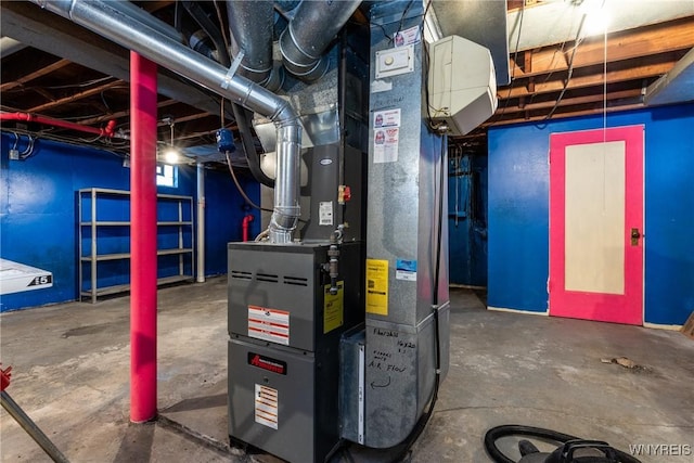 utility room featuring heating unit