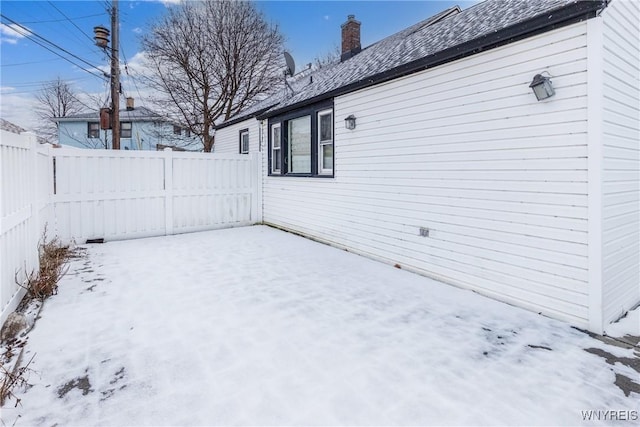 view of yard layered in snow