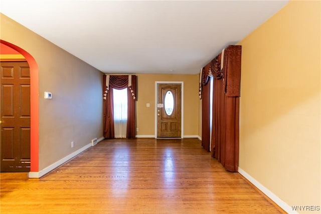 entryway with light hardwood / wood-style floors