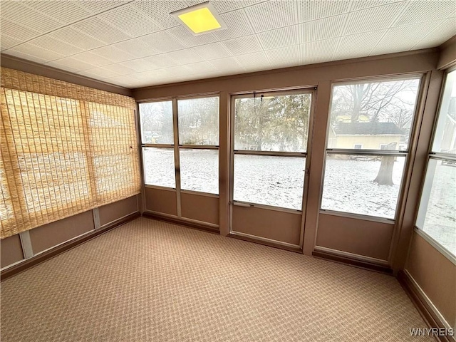 unfurnished sunroom with plenty of natural light