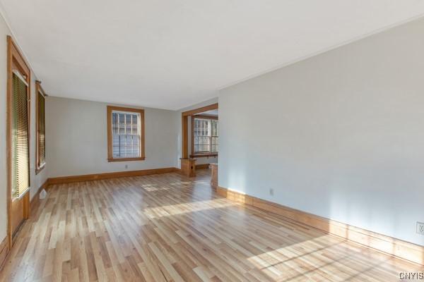 unfurnished room with light hardwood / wood-style flooring