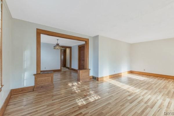 spare room with light hardwood / wood-style flooring