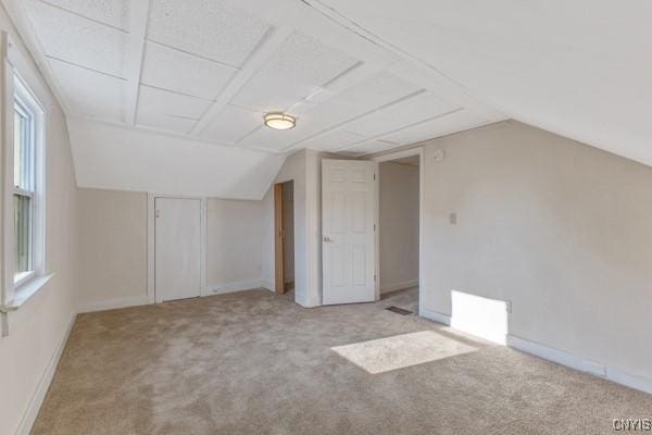 bonus room featuring light colored carpet