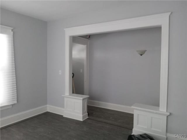 mudroom featuring dark hardwood / wood-style flooring and a wealth of natural light