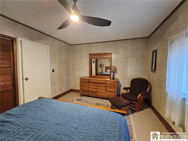 bedroom featuring carpet flooring, ceiling fan, and ornamental molding