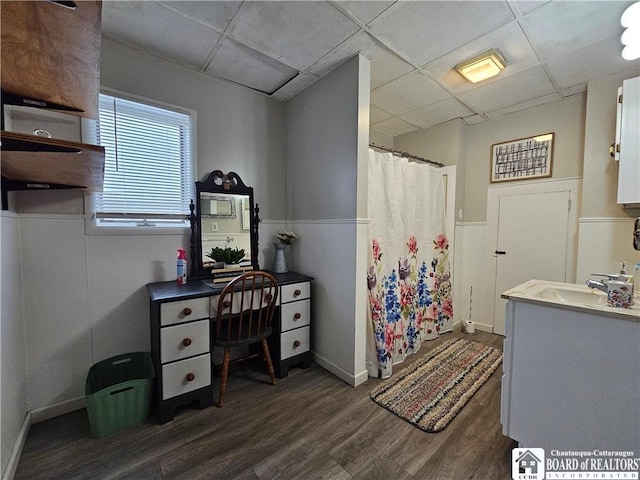 bathroom with vanity, wood-type flooring, a paneled ceiling, and a shower with shower curtain