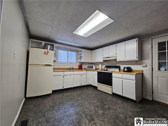 kitchen with sink, white cabinets, and white appliances