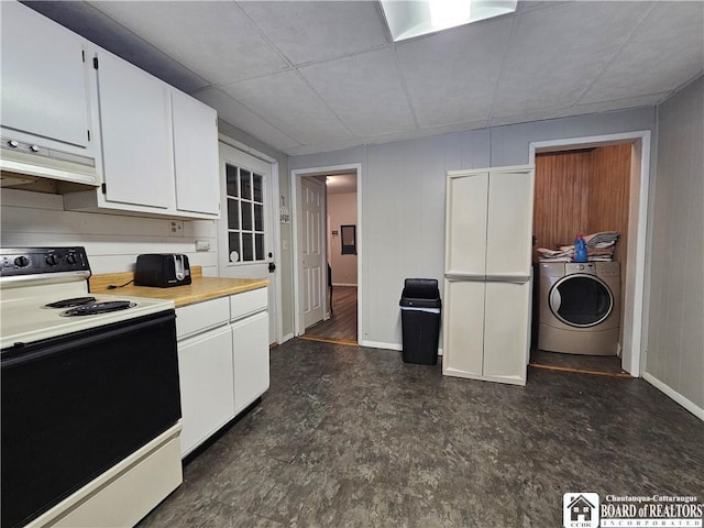 kitchen with washer and clothes dryer, white cabinetry, and electric stove