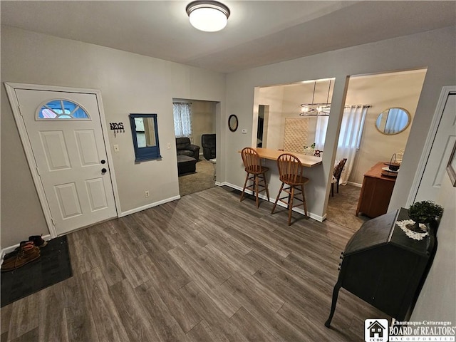 entryway with dark hardwood / wood-style floors