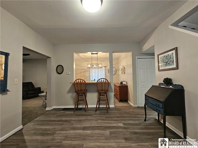 dining area with dark hardwood / wood-style flooring