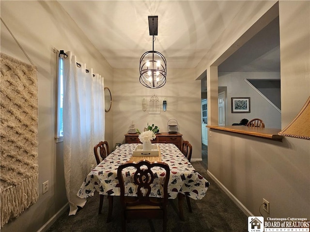 carpeted dining space featuring an inviting chandelier