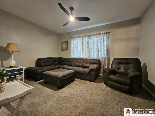 carpeted living room with ceiling fan