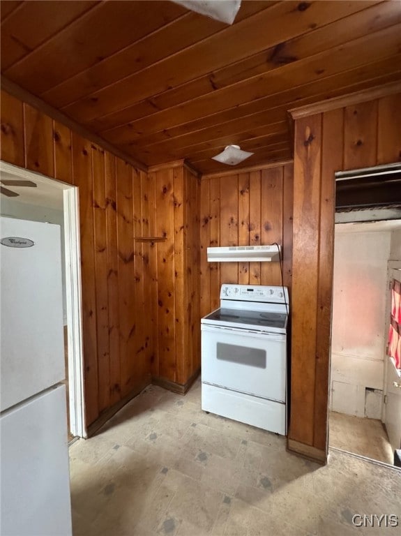 kitchen with wooden walls, white appliances, and wood ceiling