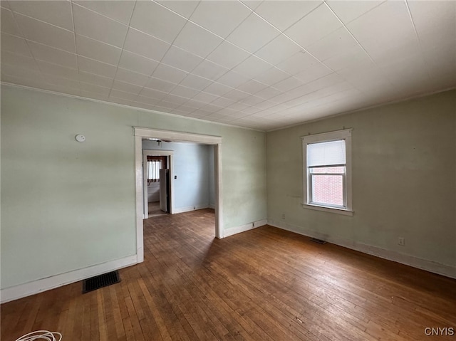 unfurnished room featuring dark hardwood / wood-style flooring