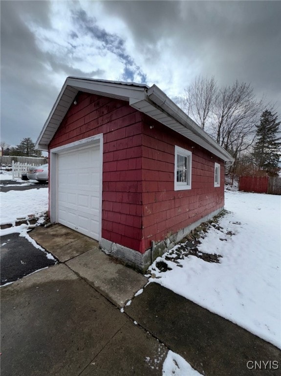 view of snow covered garage