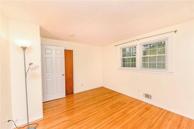 spare room with light wood-type flooring