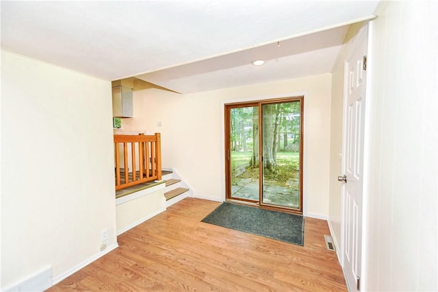 doorway to outside with light hardwood / wood-style floors