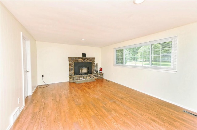 unfurnished living room featuring light wood-type flooring