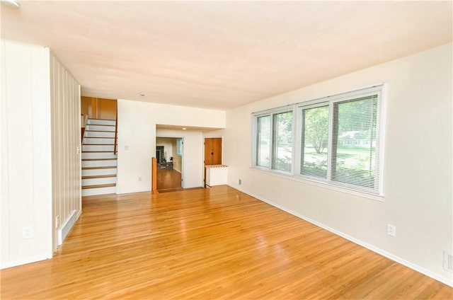 unfurnished living room featuring light wood-type flooring