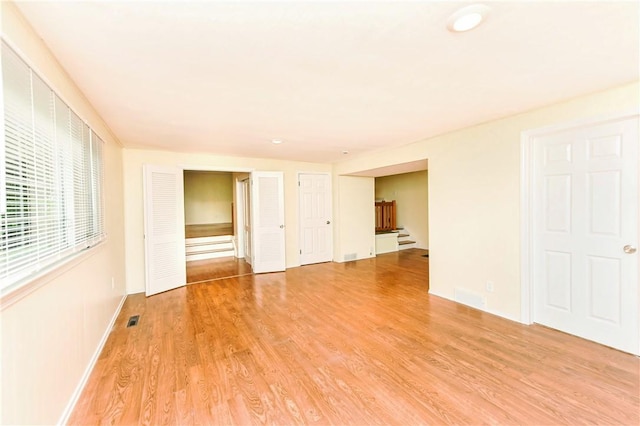 unfurnished room featuring light wood-type flooring