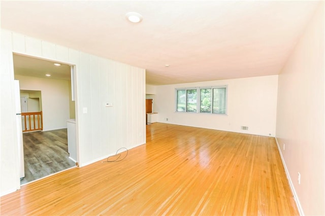 spare room featuring light hardwood / wood-style floors