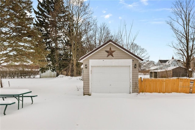 view of snow covered garage